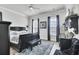 Spacious bedroom with a dark wood bed frame, a patterned rug, and natural light from multiple windows at 2928 Tranquility Rd, Mount Pleasant, SC 29466