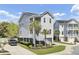 Charming gray home with a two-story porch, manicured lawn, and private driveway at 2928 Tranquility Rd, Mount Pleasant, SC 29466