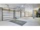 Spacious garage with three bays, high ceilings, and plenty of storage space for vehicles and equipment at 2928 Tranquility Rd, Mount Pleasant, SC 29466