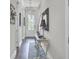 Bright hallway featuring hardwood floors, console table, and decorative mirror at 2928 Tranquility Rd, Mount Pleasant, SC 29466