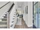 Welcoming hallway features elegant decor, hardwood floors, and access to various rooms at 2928 Tranquility Rd, Mount Pleasant, SC 29466