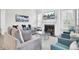 Cozy living room with fireplace, large windows, and stylish decor at 2928 Tranquility Rd, Mount Pleasant, SC 29466