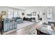 Open living room with hardwood floors, plush blue sofas, fireplace, and an arcade game table at 2928 Tranquility Rd, Mount Pleasant, SC 29466