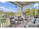 Inviting porch with comfortable seating, decorative outdoor furniture, and a scenic view of the yard at 2928 Tranquility Rd, Mount Pleasant, SC 29466