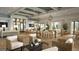 The clubhouse boasts stylish seating, elegant lighting, and comfortable tables for entertaining guests at 299 Citrus Dr, Summerville, SC 29486