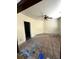 A living room undergoing renovation, covered in protective sheeting and showing early stages of painting at 3 Woodall Ct, Charleston, SC 29403