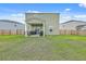 A well-manicured lawn sits behind this two-story home, featuring an open patio and a full wooden fence at 302 Fox Gap Rd, Summerville, SC 29486