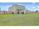 Spacious backyard featuring a covered patio and a well-maintained lawn at 302 Fox Gap Rd, Summerville, SC 29486