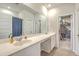 Well-lit bathroom with double sinks, a large mirror, and ample counter space, providing convenience and style at 302 Fox Gap Rd, Summerville, SC 29486