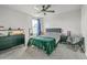Bedroom featuring a ceiling fan, a dark green comforter and grey accent chair at 302 Fox Gap Rd, Summerville, SC 29486