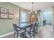 Charming dining area with a wooden table set, decorative lighting, and stylish decor at 302 Fox Gap Rd, Summerville, SC 29486