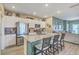 Stylish kitchen boasts stainless steel appliances, granite countertops, and an island with seating for casual dining at 302 Fox Gap Rd, Summerville, SC 29486
