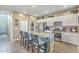 Modern kitchen with granite countertops, stainless steel appliances, and an island with barstool seating at 302 Fox Gap Rd, Summerville, SC 29486