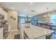 Bright, open kitchen and dining area featuring a large island, modern appliances, and ample counter space at 302 Fox Gap Rd, Summerville, SC 29486