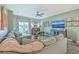 Comfortable living room with a large sectional sofa, television, and access to the backyard, creating a relaxing atmosphere at 302 Fox Gap Rd, Summerville, SC 29486
