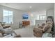 Spacious living room with plush brown leather couches and neutral carpeting at 302 Fox Gap Rd, Summerville, SC 29486