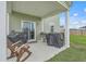 Covered patio with outdoor seating and grilling area, perfect for entertaining at 302 Fox Gap Rd, Summerville, SC 29486