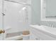 Bright bathroom featuring a tiled shower with a glass door, a single sink vanity, and a modern design at 3030 Baltimore St, Charleston, SC 29492