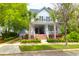 Charming home with a welcoming front porch, palm trees, and lush landscaping at 3030 Baltimore St, Charleston, SC 29492