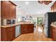Bright kitchen features wood cabinets, granite countertops and stainless steel appliances at 3030 Baltimore St, Charleston, SC 29492