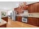 Modern kitchen with stainless steel appliances, granite countertops, and wood cabinets at 3030 Baltimore St, Charleston, SC 29492