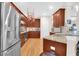 Updated kitchen features stainless steel appliances, granite counters and wood cabinets at 3030 Baltimore St, Charleston, SC 29492