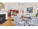 Cozy living room with a fireplace, floral sofas, and hardwood floors at 3030 Baltimore St, Charleston, SC 29492