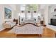 Bright living room with high ceilings, large windows, and floral furniture at 3030 Baltimore St, Charleston, SC 29492