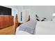 Bright main bedroom features a carved wood bed frame, a fitness bike, and access to the ensuite bathroom at 3030 Baltimore St, Charleston, SC 29492
