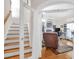Spacious living area with a staircase leading to a study and a cozy recliner at 3030 Baltimore St, Charleston, SC 29492