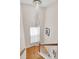 Staircase features hardwood stairs, white railings and decorative lighting at 3030 Baltimore St, Charleston, SC 29492