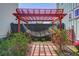 Backyard view with a hammock under a wooden pergola, enhancing the serene outdoor living space at 310 Ripple Park Dr, Summerville, SC 29486