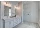 Modern bathroom with double vanity, large mirrors, and a glass enclosed shower with subway tile at 310 Ripple Park Dr, Summerville, SC 29486