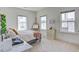 Well-lit bedroom with a desk, large windows, and bright interior showcasing a flexible living space at 310 Ripple Park Dr, Summerville, SC 29486