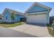 Charming home featuring a two-car garage, driveway, and well-maintained landscaping at 310 Ripple Park Dr, Summerville, SC 29486