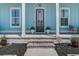 Inviting front porch with stylish decor and well-manicured landscaping details at 310 Ripple Park Dr, Summerville, SC 29486