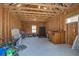 Spacious unfinished garage with exposed wood framing, ample storage, and potential for customization at 310 Ripple Park Dr, Summerville, SC 29486