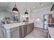 Open concept kitchen with a large island, stainless steel appliances, and ample cabinet space at 310 Ripple Park Dr, Summerville, SC 29486