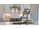 Beautiful kitchen with stainless steel appliances, tiled backsplash, and a gold faucet at 310 Ripple Park Dr, Summerville, SC 29486