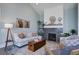 Cozy living room with fireplace, comfortable seating, and stylish decor at 310 Ripple Park Dr, Summerville, SC 29486