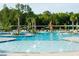 A fantastic splash pool with plenty of chairs, tables, and umbrellas to enjoy in this gorgeous community at 310 Ripple Park Dr, Summerville, SC 29486