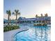 A gorgeous resort-style pool with lounge seating, lush plants, and relaxing ambiance in the community at 310 Ripple Park Dr, Summerville, SC 29486