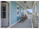 Charming porch with seating provides a relaxing outdoor space with a view of the neighborhood at 310 Ripple Park Dr, Summerville, SC 29486