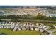 Expansive aerial view of a Primary-planned community featuring a series of ponds and lush green spaces at 332 Long Pier St, Summerville, SC 29486