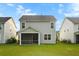 Back of house with screened porch and backyard with green lawn at 332 Long Pier St, Summerville, SC 29486