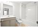 Bathroom with single vanity, mirror, and shower and tub combination at 332 Long Pier St, Summerville, SC 29486