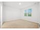 Bright, spacious bedroom with neutral carpet, fresh paint, and a large window at 332 Long Pier St, Summerville, SC 29486
