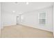 Bright bedroom with neutral carpet, white walls, and two windows at 332 Long Pier St, Summerville, SC 29486