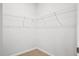 Corner of a walk-in closet, carpeted with wire shelving installed at 332 Long Pier St, Summerville, SC 29486
