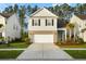 Beautiful two-story home with a two-car garage, lovely front yard, and inviting curb appeal at 332 Long Pier St, Summerville, SC 29486